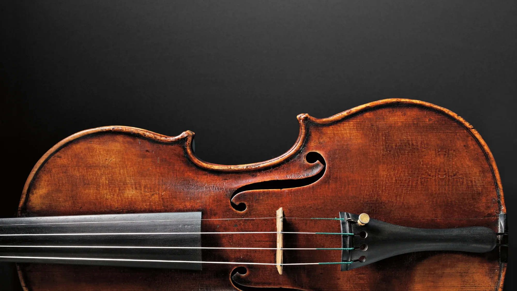 Antique violin on a dark background